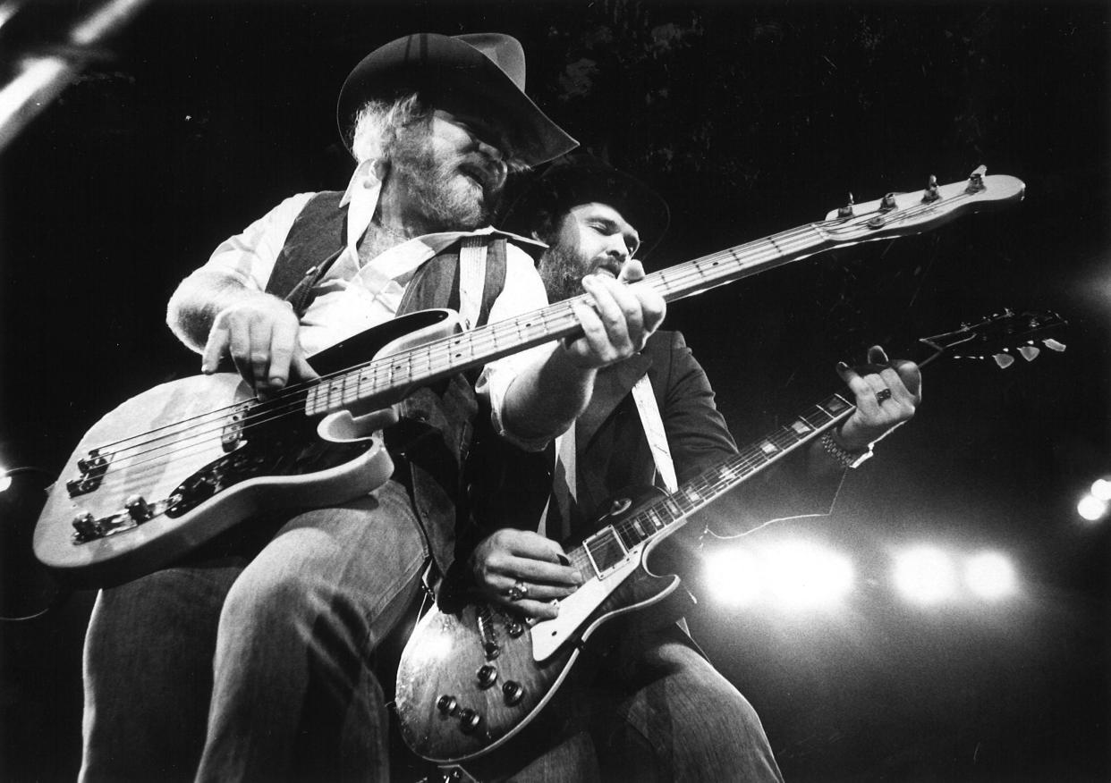 ZZ Top's Dusty Hill, left, and Billy Gibbons duel during the band's 1977 show in Abilene and first at the Taylor County Coliseum.