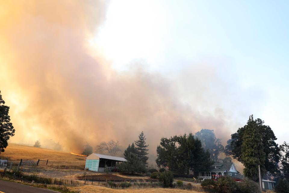 A vegetation fire burns near Jory Hill Road and Liberty Road South on Wednesday, Aug. 23, 2023 in Salem, Ore.