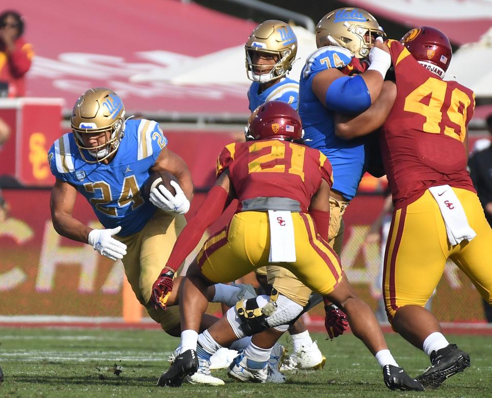 Zach Charbonnet runs the ball against USC in the first half of UCLA's 63-33 win on Nov. 20 at Coliseum.