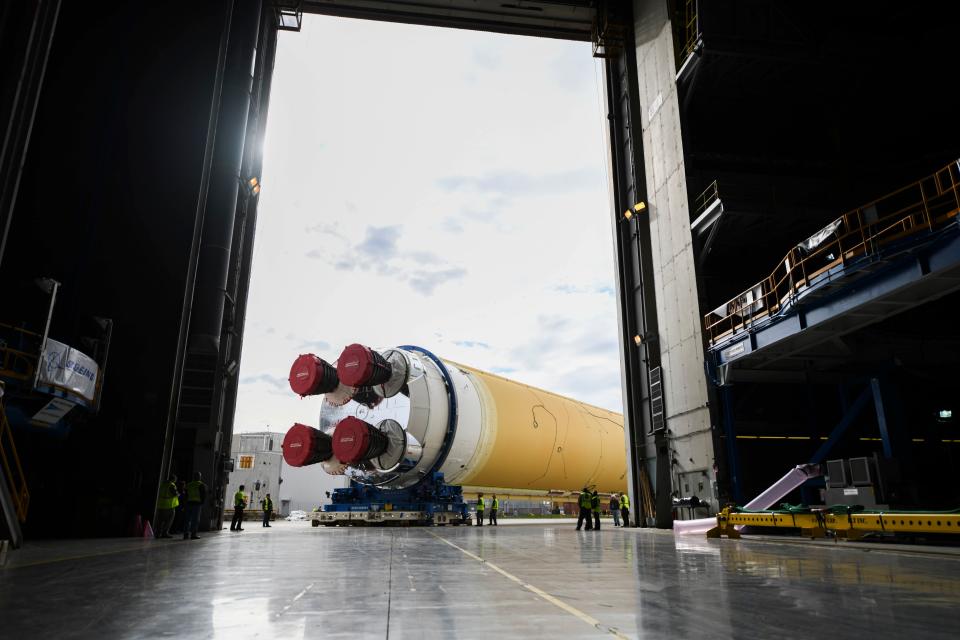 This NASA photo released on January 6, 2020 shows NASAs powerful new rocket, the Space Launch System (SLS), which will send astronauts a quarter million miles from Earth to lunar orbit at the Michoud Assembly Facility in New Orleans, Louisiana. - The agency is committed to landing American astronauts, including the first woman and the next man, on the Moon by 2024. Through the agencys Artemis lunar exploration program, we will use innovative new technologies and systems to explore more of the Moon than ever before.On January 1, 2020, NASA Administrator Jim Bridenstine tweeted: "Making progress! The massive @NASA_SLS core stage is moving to Building 110 at the Michoud Assembly Facility in Louisiana. There it will be readied for the Pegasus barge and its trip to @NASAStennis. Thank you to the @NASA team for working through the holidays!" (Photo by Jude Guidry / NASA / AFP) (Photo by JUDE GUIDRY/NASA/AFP via Getty Images)