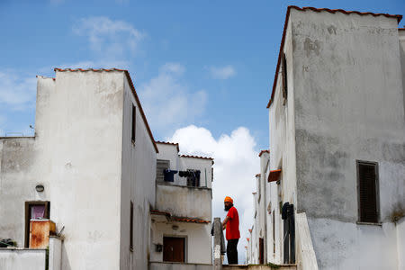 A Sikh migrant worker stands next to his home in Bella Farnia, in the Pontine Marshes, south of Rome. Originally from IndiaÕs Punjab state, the migrant workers pick fruit and vegetables for up to 13 hours a day for between 3-5 euros ($3.30-$5.50) an hour, in Bella Farnia, Italy May 19, 2019. Picture taken May 19, 2019 REUTERS/Yara Nardi