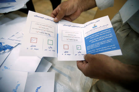 Officials sort ballot papers after the close of the polling station during Kurds independence referendum in Erbil, Iraq September 25, 2017. REUTERS/Azad Lashkari