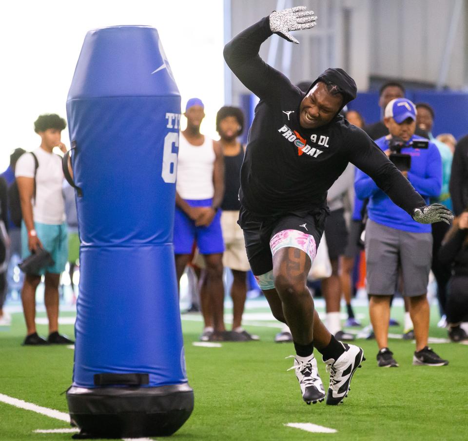 Florida Gators defensive lineman Gervon Dexter Sr. (9) attacks a tackling dummy during the 2023 NFL Pro Day held at Condron Family Indoor Practice Facility in Gainesville, FL on Thursday, March 30, 2023. [Doug Engle/Gainesville Sun]