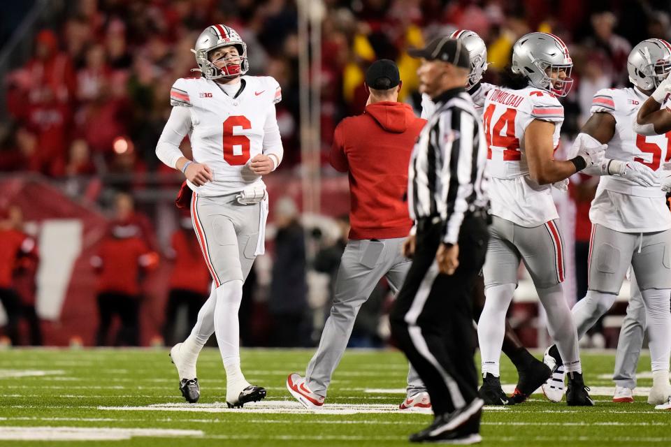 Oct 28, 2023; Madison, Wisconsin, USA; Ohio State Buckeyes quarterback Kyle McCord (6) jogs off the field after throwing an interception during the first half of the NCAA football game against the Wisconsin Badgers at Camp Randall Stadium.