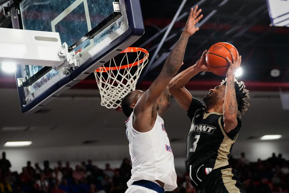 Bryant guard Sherif Gross-Bullock gets off a shot against Florida Atlantic guard Johnell Davis during a game in November. The Bulldogs' upset win may have turned their season around.