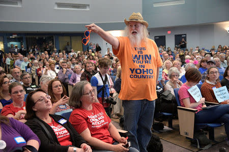 Military veteran Bruce Borders asks a question of U.S. Representative Ted Yoho (R-FL) during a town hall meeting in Gainesville, Florida, U.S., April 10, 2017. REUTERS/Phelan Ebenhack