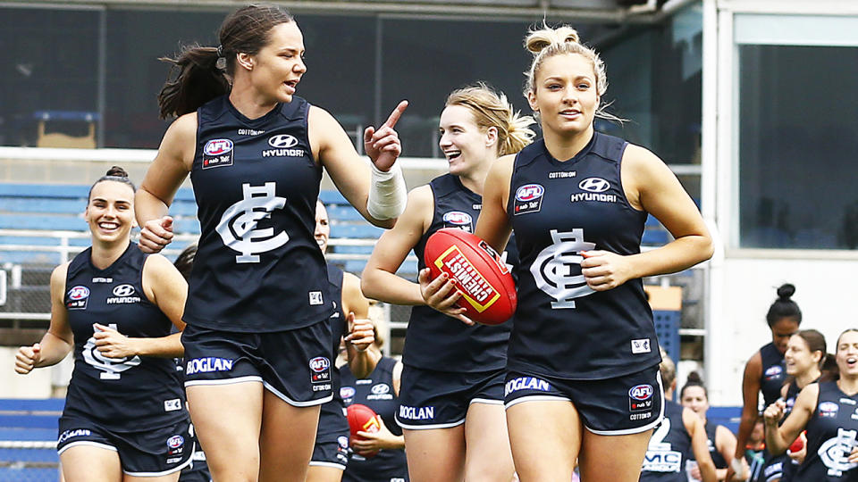 Carlton Blues players, pictured here running out before their AFLW semi-final against Brisbane Lions.