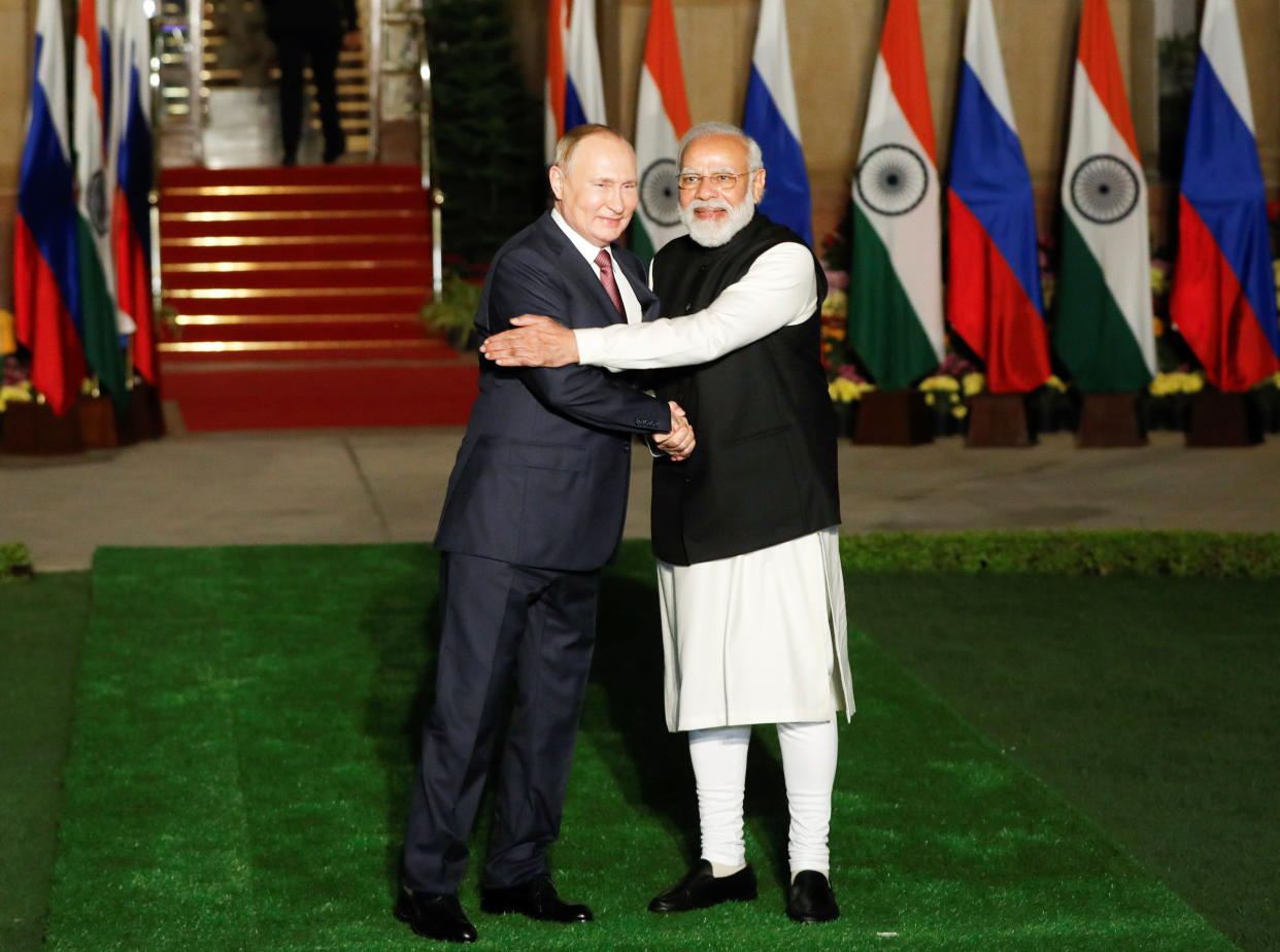 Russia's President Vladimir Putin shakes hands with India's Prime Minister Narendra Modi ahead of their meeting at Hyderabad House in New Delhi, India, December 6, 2021. REUTERS/Adnan Abidi