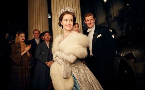 Claire Foy, centre, and Matt Smith, right, in a scene from The Crown. Last month it emerged there was a gulf in their pay - Credit: Robert Viglasky/Netflix