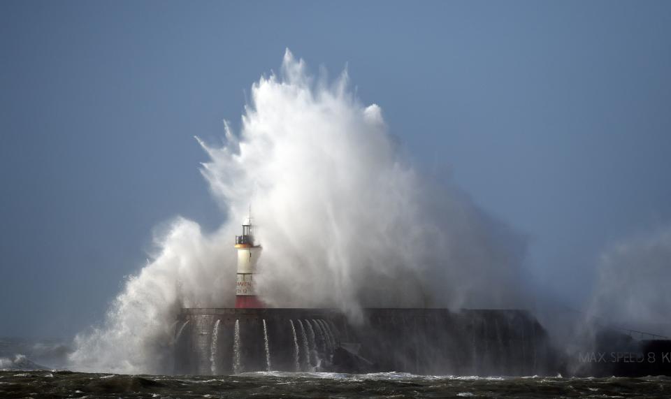 <p>Waves crash over the harbour wall in Newhaven, southern England on March 11, 2021 as heavy gusts hit the south coast. (Photo by GLYN KIRK / AFP) (Photo by GLYN KIRK/AFP via Getty Images)</p>
