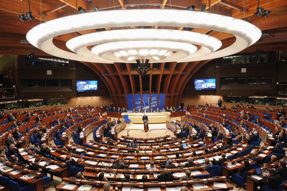 The UK government has criticised the Council of Europe’s (CoE) decision to approve restoring Russia’s voting rights, five years after it lost them due to its illegal annexation of Crimea.Despite protests from Ukraine and Georgia, the council’s Parliamentary Assembly voted 118-62 in favour of the measure in the early hours of Tuesday, marking the first time an international sanction imposed for Moscow's seizure of the peninsula has been reversed. It came after Russia threatened to leave entirely if it was blocked from participating in a vote to decide the council’s new secretary general.The resolution will allow Russia to participate in its June session, but the move still faces procedural challenges.The decision, supported by France and Germany, was designed in part to keep communication open at a time of East-West tensions, and represents a diplomatic boost for Moscow, which has spent billions of dollars integrating Crimea but failed to secure Western recognition of the move. A Foreign Office spokesperson told The Independent the government “does not support Russia’s unconditional return” to the assembly - a view apparently not shared by Lord Richard Balfe, a Conservative member of the assembly who voted in favour of the measure. “We have consistently called on Russia to pay all outstanding budgetary contributions to the Council of Europe, and show that it takes seriously the values of the Council of Europe – including human rights,” the spokesperson said.“We expect Russia to pay its bills immediately, and to reaffirm publicly its commitment to all CoE obligations.” The CoE - entirely separate from the European Union - is the guardian of the European Convention on Human Rights and creator of the European Court of Human Rights (ECHR) in Strasbourg. It is tasked with promoting the rule of law and human rights within its 47 member states. Ukraine's pro-Western prime minister, Volodymyr Groysman, said the vote showed "a display of utter contempt for international law" and Kiev recalled the country’s permanent representative to the council. Some 30 parliamentarians from Ukraine, Georgia and Baltic nations staged a protest by contesting the Russian delegation's credentials, formally delaying Moscow's reinstatement until another vote on Wednesday at which the credentials are expected to be ratified.But some observers argued Russia’s absence from the council could be disastrous for citizens in the country, as the ECHR has proved to be the last resort for many Russians unable to receive justice at home.The largest percentage of cases ruled on by the ECHR come from Russia.Last week, French president Emmanuel Macron, who along with German leader Angela Merkel was one of the main lobbyists for the change, said non-membership harmed Russian citizens, and not its government. “We want to ensure [Russian citizens] have the opportunity to defend their rights,” he said. Lord Balfe told The Independent: "I think we must decide whether we are doing our best for the people of Russia by continuing to exclude their Parliamentarians from the Council of Europe."We need to reopen dialogue, the exclusion of Russia now needs to end. Most if not all the EU States representatives support resuming dialogue, only out of touch Cold War dinosaurs such as Sir Roger Gale want to continue with sanctions and the 'Russia hate fest'."I together with a majority of Members here believe that the resumption of relationships with conditions regarding issues to be addressed is the sensible way forward. We have had a lot of Churchill quotes here but not yet 'jaw-jaw is better than war-war'."In a conference call on Tuesday, Dmitry Peskov, spokesperson for Vladimir Putin, said: "This is a very positive thing. We can only be positive about it.""This is not a diplomatic victory for Moscow but for common sense. Parliament assembly can't work without the contribution of Russian delegation."Provocatively, the Russian government immediately nominated Leonid Slutsky, chairman of the Duma's foreign affairs committee, to be vice chair of the parliamentary assembly. Mr Slutsky is still included in EU sanctions brought in response to the Russian annexation of Crimea.While the West accuses Moscow of covert operations to try to undermine its democracies, European diplomats said part of the reason for supporting its return was economic. Moscow's departure left a €90m (£81m) hole in the council's budget - around seven per cent of contributions.Additional reporting by agencies