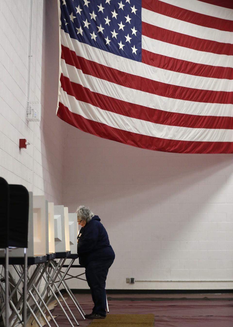 Nancy Tynan votes Tuesday at the University of Wisconsin-Oshkosh Fox Cities Campus in Menasha.