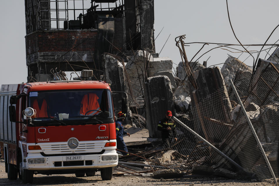 Firefighters search for trapped people at a damaged structure following an earthquake at the port of Piraeus, near Athens, on Friday, July 19, 2019. The Athens Institute of Geodynamics gave the earthquake a preliminary magnitude of 5.1 but the U.S. Geological Survey gave it a preliminary magnitude of 5.3. The Athens Institute says the quake struck at 2:38 p.m. local time (1113 GMT) about 26 kilometers (13.7 miles) north of Athens. (AP Photo/Petros Giannakouris)