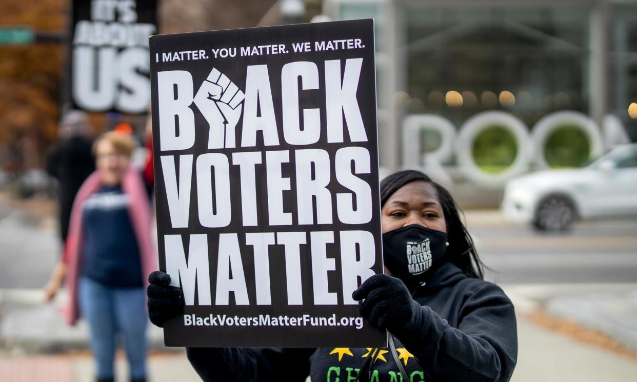 <span>Protesters in Atlanta, Georgia, on 9 December 2021.</span><span>Photograph: Erik S Lesser/EPA</span>