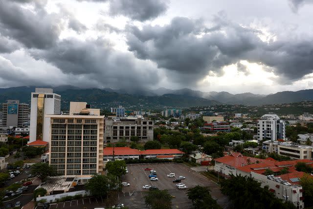 <p>Joe Raedle/Getty</p> Storm clouds in Kingston, Jamaica, as Hurricane Beryl approaches on July 3