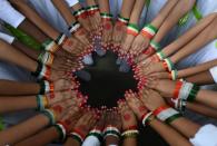 <p>Indian schoolchildren wear tricolour bangles as they pose in a circle while performing during Indian Independence Day celebrations at South Central Railway Grounds in Secunderabad, the twin city of Hyderabad on August 15, 2016. Prime Minister Narendra Modi said India was becoming the world’s most attractive destination for foreign investors, using his annual Independence Day speech to trumpet sweeping tax reforms designed to spur growth. In an address from Delhi’s 17th-century Red Fort, Modi sought to highlight his government’s achievements, including the recent passage of a landmark tax reform, that have contributed to India’s robust growth during a global slowdown. </p>