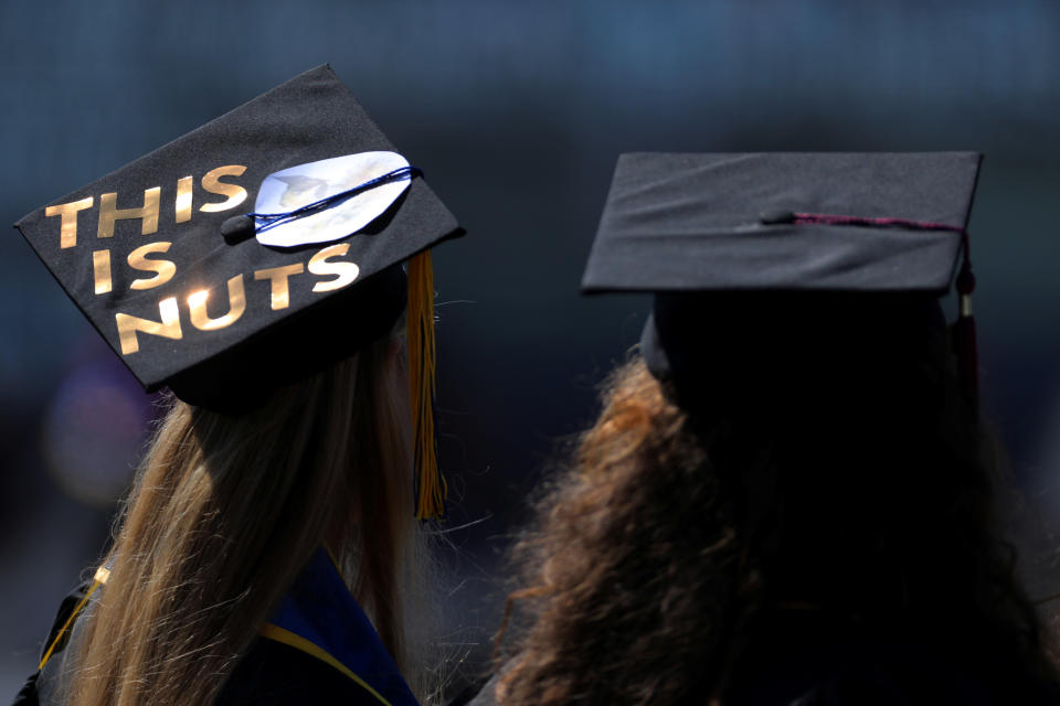 Messages and artwork are pictured on the top of the caps of graduating students during their graduation ceremony at UC San Diego in San Diego, California, U.S. June 17, 2017. (Photo: REUTERS/Mike Blake)