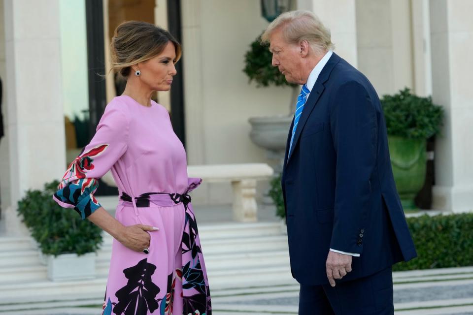 Donald Trump, right, stands with Melania Trump as they arrive for a GOP fundraiser on Saturday in West Palm Beach (AP)