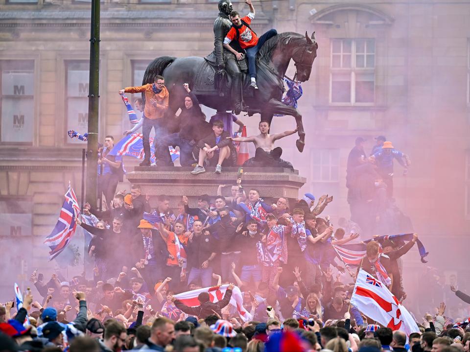 Rangers fans celebrate in George Square on SaturdayGetty