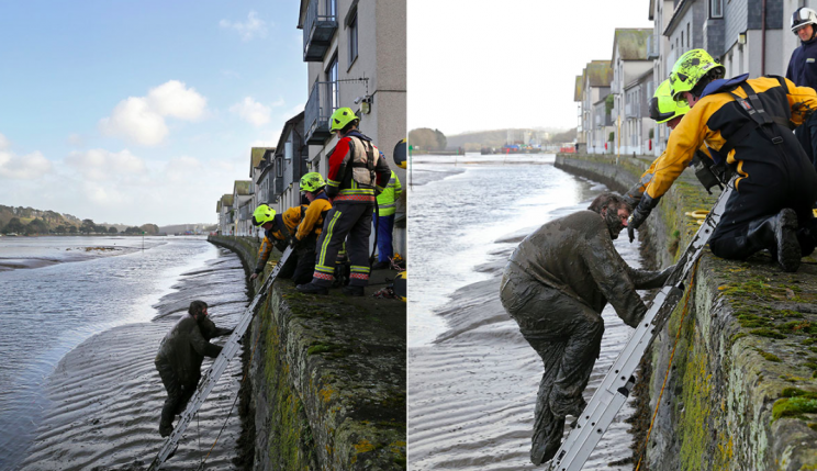 Firefighters lowered a ladder so the pair could escape (SWNS)