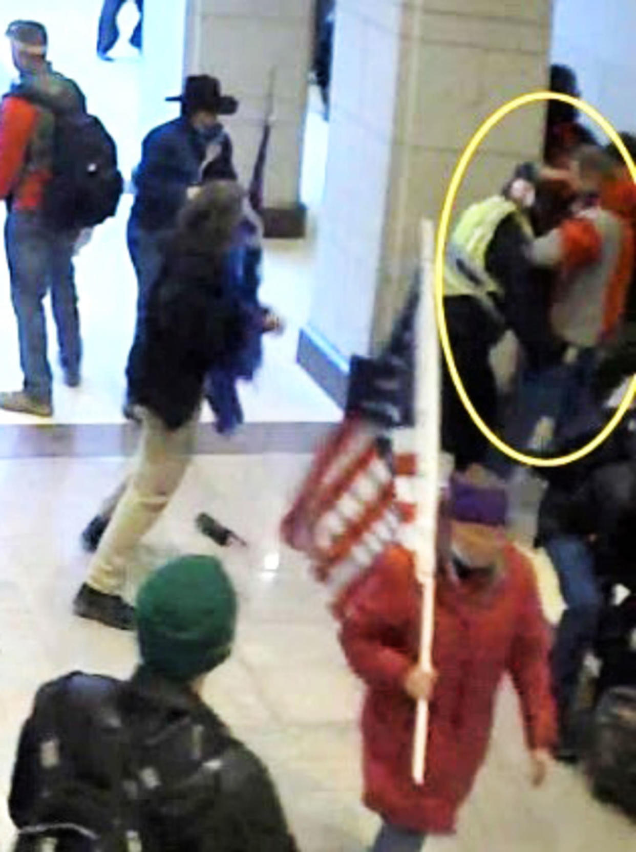 Joseph Fisher assaults a Capitol Police officer inside the Capitol. (USDCDC)