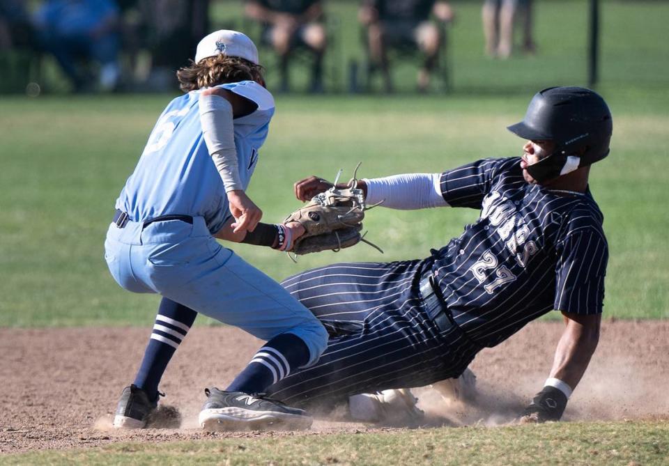 Oakmont second baseman Trevor Wilson tags out Central Catholic runner Joel Roberts during the Northern California Regional Division III championship game at Central Catholic High School in Modesto, Calif., Saturday, June 3, 2023.