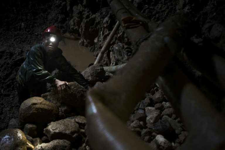 A miner works inside a ruby mine in Mogok, Myanmar