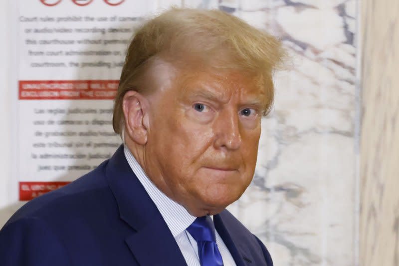 Former United States President Donald Trump returns to the court room after a break in his civil fraud trial at State Supreme Court on Oct. 25 in New York City. The case brought last September by New York Attorney General Letitia James, accusing Trump, his eldest sons and his family business of inflating Trump's net worth by more than $2 billion by overvaluing his real estate portfolio. On Friday, a Colorado district judge ruled Trump is eligible to be on the state's 2024 presidential primary ballot, rejecting claims the former president should be barred under a constitutional amendment that disqualifies candidates who've engaged in "insurrection or rebellion" against the United States. Photo by John Angelillo/UPI