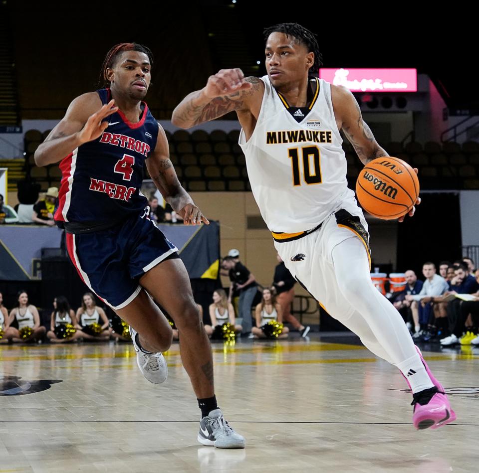 Milwaukee Panthers guard BJ Freeman (10) drives the ball as he is guarded by Detroit Mercy Titans guard Marcus Tankersley (4) during the second half of their game on Thursday January 25, 2024 at the UW-Milwaukee Panther Arena in Milwaukee, Wis.