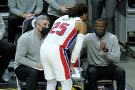 Detroit Pistons head coach Dwane Caseym], right, talks with guard Derrick Rose (25) during the first half of an NBA basketball game against the Miami Heat, Saturday, Jan. 16, 2021, in Miami. (AP Photo/Lynne Sladky)