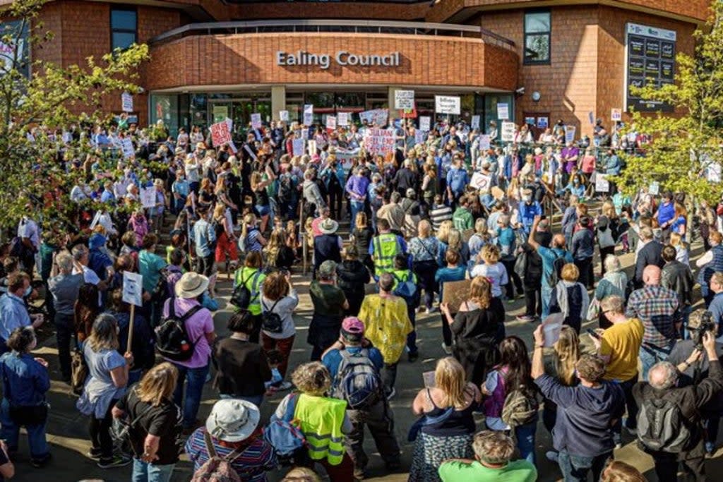 Hundreds of protestors surrounded Ealing Town Hall.  (PA)