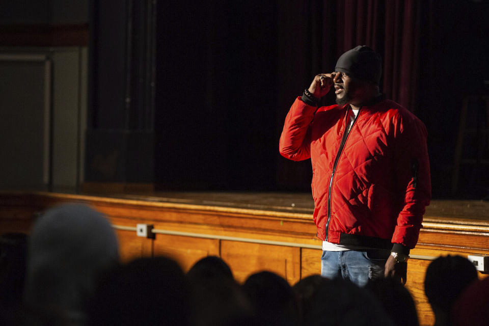 In this image provided by the Des Moines Public Schools, Will Keeps speaks to students at Harding Middle School in Des Moines. Iowa, during their annual Career Day on Nov. 15, 2019. Keeps is hospitalized in serious condition after surgery following just the sort of violence he's devoted his life to stop -- a shooting that killed two teenagers at the Starts Right Here educational program he founded in Des Moines. Keeps was hurt Monday, Jan. 23, 2023, when he tried to intervene. (Jon Lemons/Des Moines Public Schools via AP)