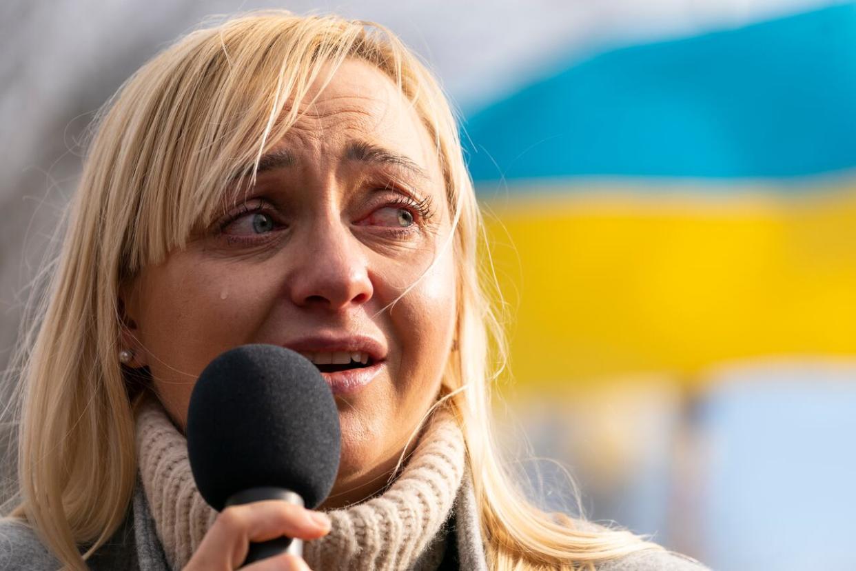 Ukrainian parliament member Oleksandra Ustinova cries as she speaks during a protest against Russia's invasion of Ukraine, in Lafayette Park in Washington, D.C., on March 13, 2022. (Alex Brandon/The Associated Press - image credit)