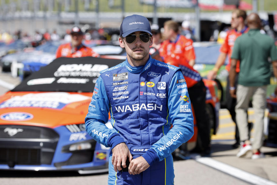 Ryan Blaney walks to his car before practice for a NASCAR Cup Series auto race at Kansas Speedway in Kansas City, Kan., Saturday, May 14, 2022. (AP Photo/Colin E. Braley)