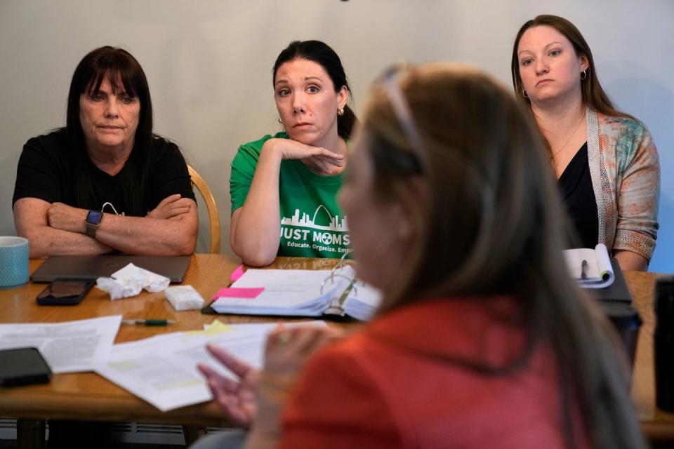 a group of women sitting at a table