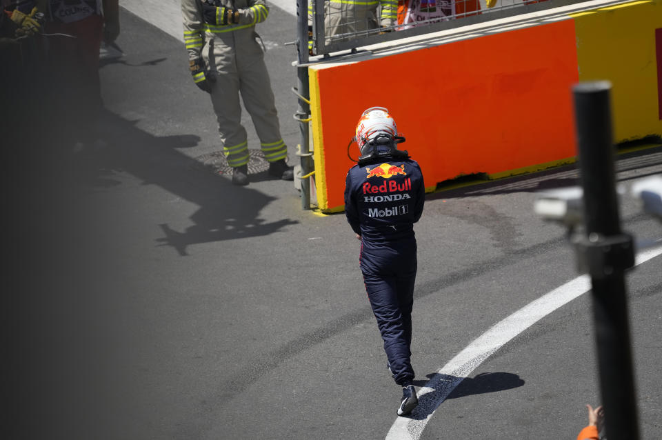 Red Bull driver Max Verstappen of the Netherlands walks off the track after his car hit a wall during the third free practice session at the Baku Formula One city circuit in Baku, Azerbaijan, Saturday, June 5, 2021. The Azerbaijan Formula One Grand Prix will take place on Sunday. (AP Photo/Darko Vojinovic)