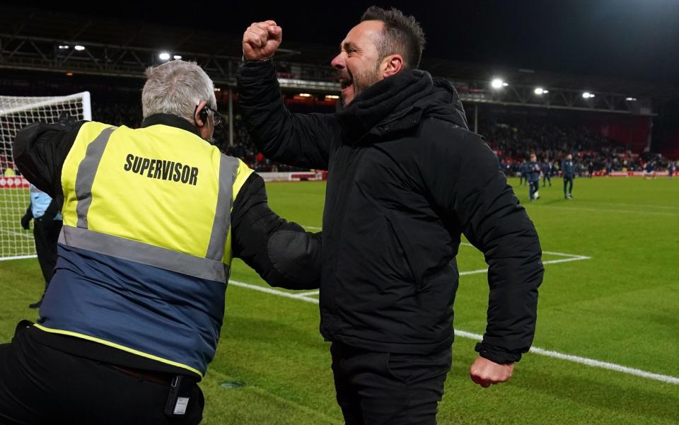 Roberto De Zerbi sprints over to the Brighton supporters at the final whistle