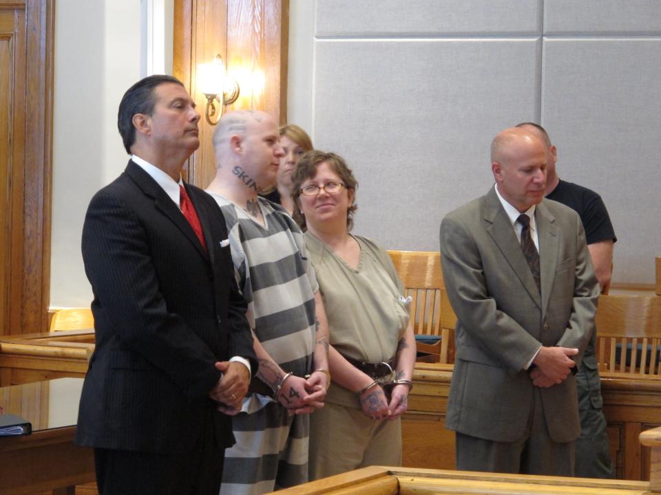From left, lawyer Harry Dest, Jeremy Moody, Christine Moody and lawyer Derek Chiarenza wait for a judge to sentence the Moody's to life in prison on Tuesday, May 6, 2014, in Union, S.C. Prosecutors said the husband and wife killed Charles Parker in his home in July 2013 because he was a sex offender and his wife Gretchen Parker because she was there. (AP Photo/Jeffrey Collins)