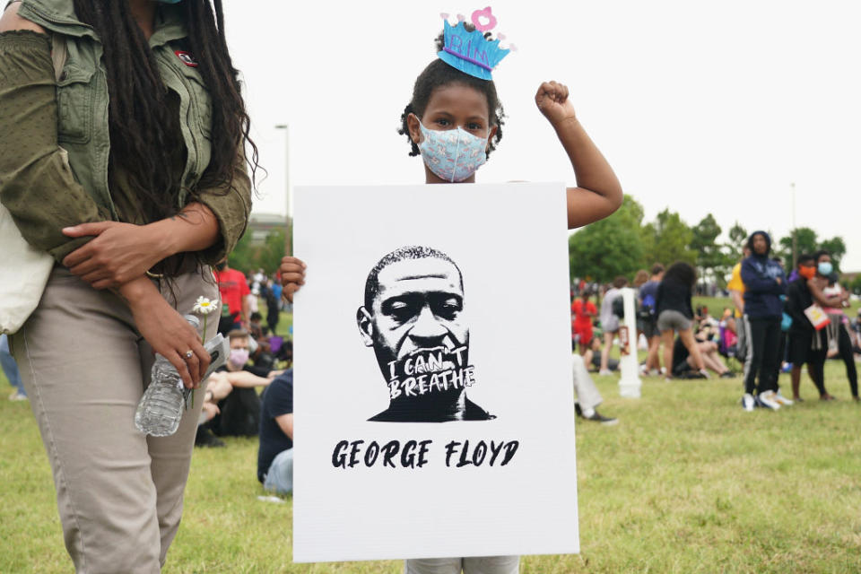 A young girl holds her hand in a fist during the June 19, 2020 Juneteenth celebration in Tulsa, Oklahoma’s Greenwood District. (Michael B. Thomas/Getty Images)