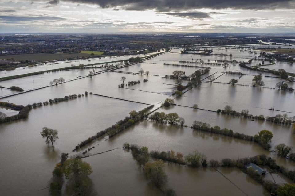 <p>Floodwater covers roads and local houses in Fishlake</p>Getty