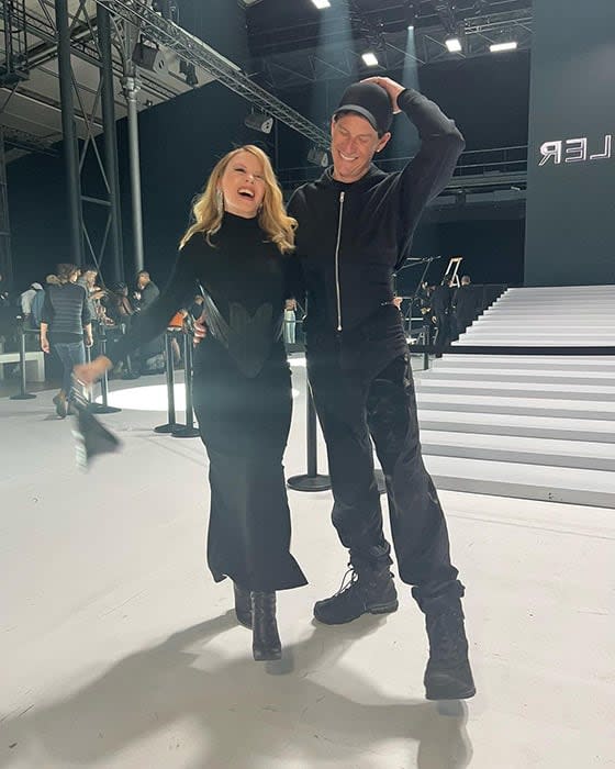 Kylie Minogue posing with Muglers designer during Paris Fashion Week