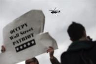 A New York police department helicopter monitors an Occupy Wall Street protest march in New York April 1, 2012.