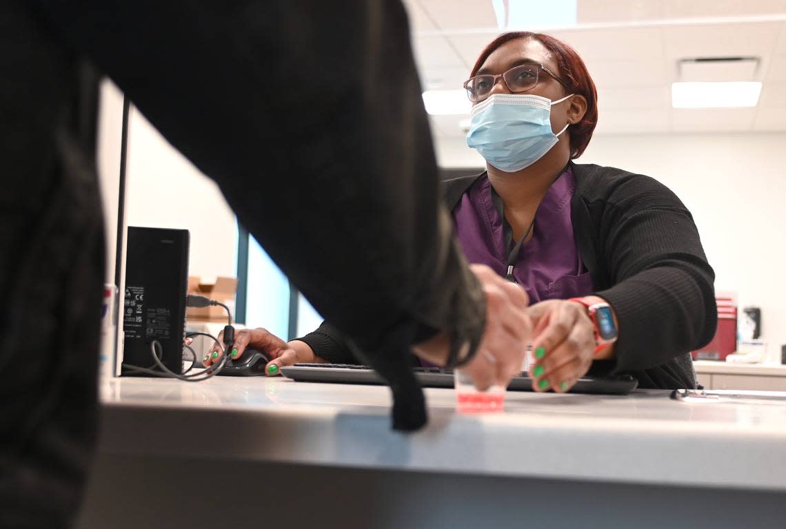 LaPorsha Miller, a licensed practical nurse, dispenses methadone to a patient at the McLeod Centers for Wellbeing in Charlotte on Tuesday. Those who run treatment centers in North Carolina expect many more people with addiction will soon seek treatment, thanks to a Medicaid expansion deal reached by state lawmakers.