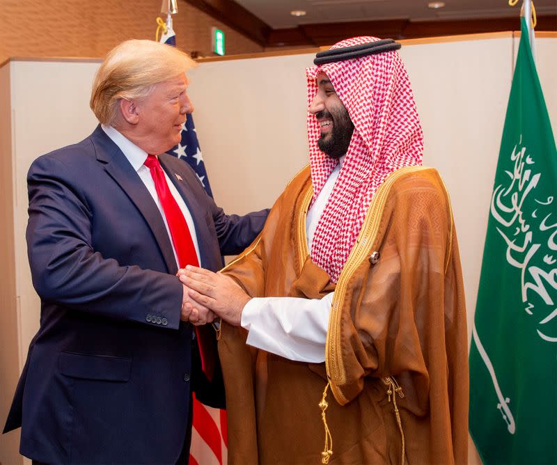 FILE PHOTO: Saudi Arabia's Crown Prince Mohammed bin Salman shakes hands with U.S. President Donald Trump, at the G20 leaders summit in Osaka