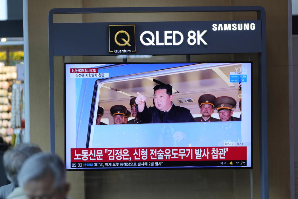 People watch a TV screen show a news program reporting North Korean leader Kim Jong Un was observing a test-firing of a newly developed tactical guided weapon, at a train station in Seoul, South Korea, Sunday, April 17, 2022. North Korea said Sunday it has successfully test-fired a newly developed tactical guided weapon, the latest in a spate of launches that came just after the country passed its biggest state anniversary without an expected military parade, which it typically uses to unveil provocative weapons systems. (AP Photo/Lee Jin-man)
