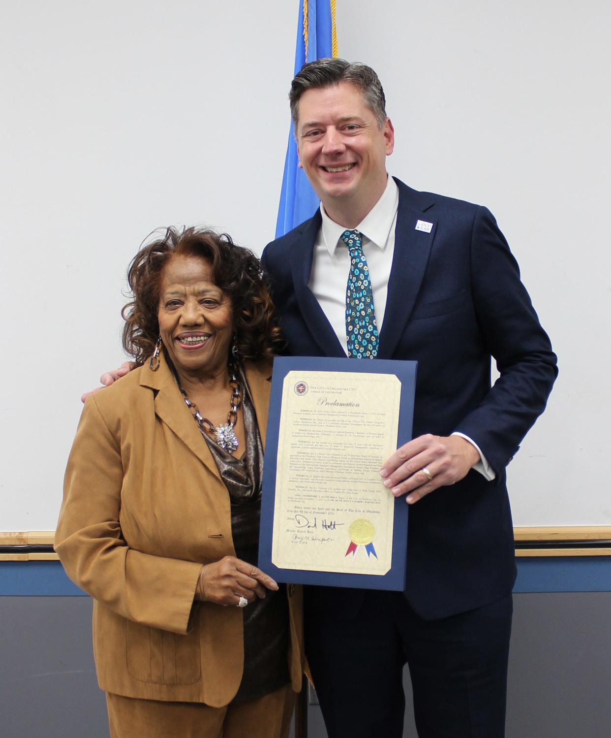 While at the Ralph Ellison Library, 2000 NE 23rd St, on Friday, Oklahoma City Mayor David Holt, left, honored Dr. Ruth Joyce Colbert Barnes, right, by proclaiming Nov. 11, 2023, as Dr. Ruth Joyce Colbert Barnes Day in the City of Oklahoma City. [PHOTO PROVIDED]