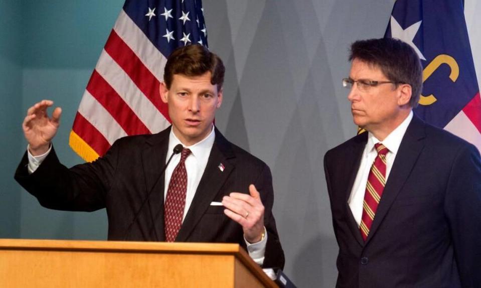 On March 5, 2015, newly appointed State Budget Director Lee Roberts, left, addresses members of the media, as N.C. Governor Pat McCrory listens They unveiled the governor’s proposed 2015-2017 budget for the state.