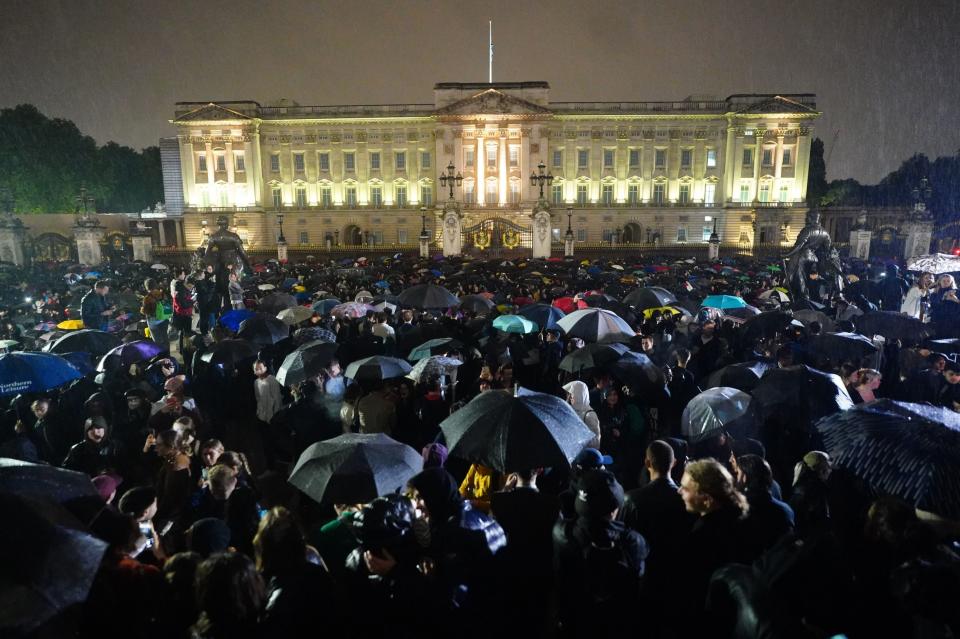 Mourners gathered outside Buckingham Palace (PA)