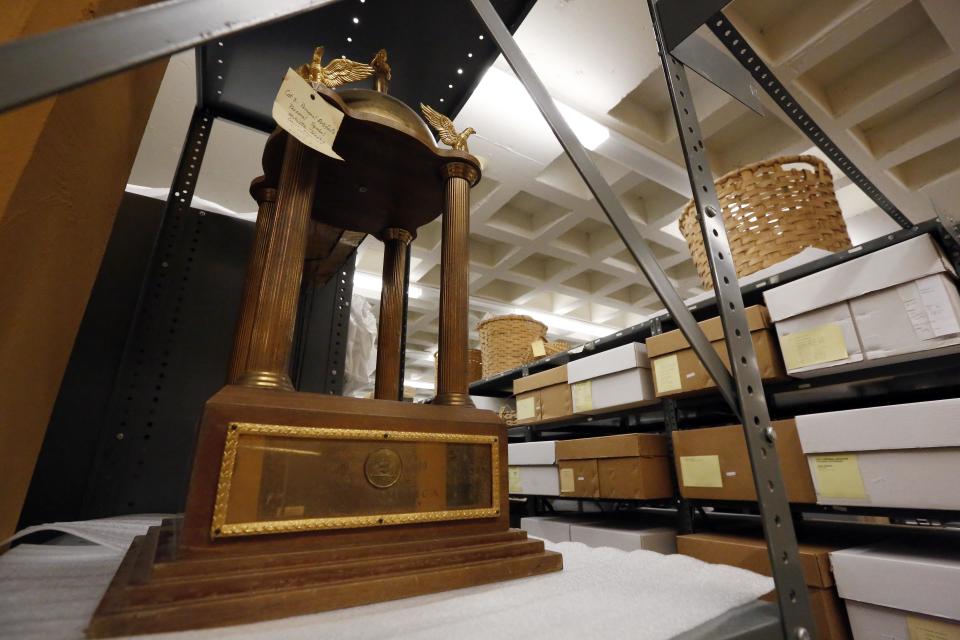 In this Oct. 11, 2013 photograph, the trophy Mary Ann Mobley was awarded in 1959 when she was crowned Miss America, rests on shelves that hold other items documenting Mississippi's long history in Jackson, Miss. Many of the items currently in storage will find a home in one of the state's planned new museums. Officials say they did not set out to have separate-but-equal museums for the documentation of the state's history, but it could end up that way. Mississippi breaks ground Thursday. Oct. 24, 2013, on side-by-side museums that are expected to break ground of their own in how they depict the Southern state once rocked by racial turmoil. (AP Photo/Rogelio V. Solis)