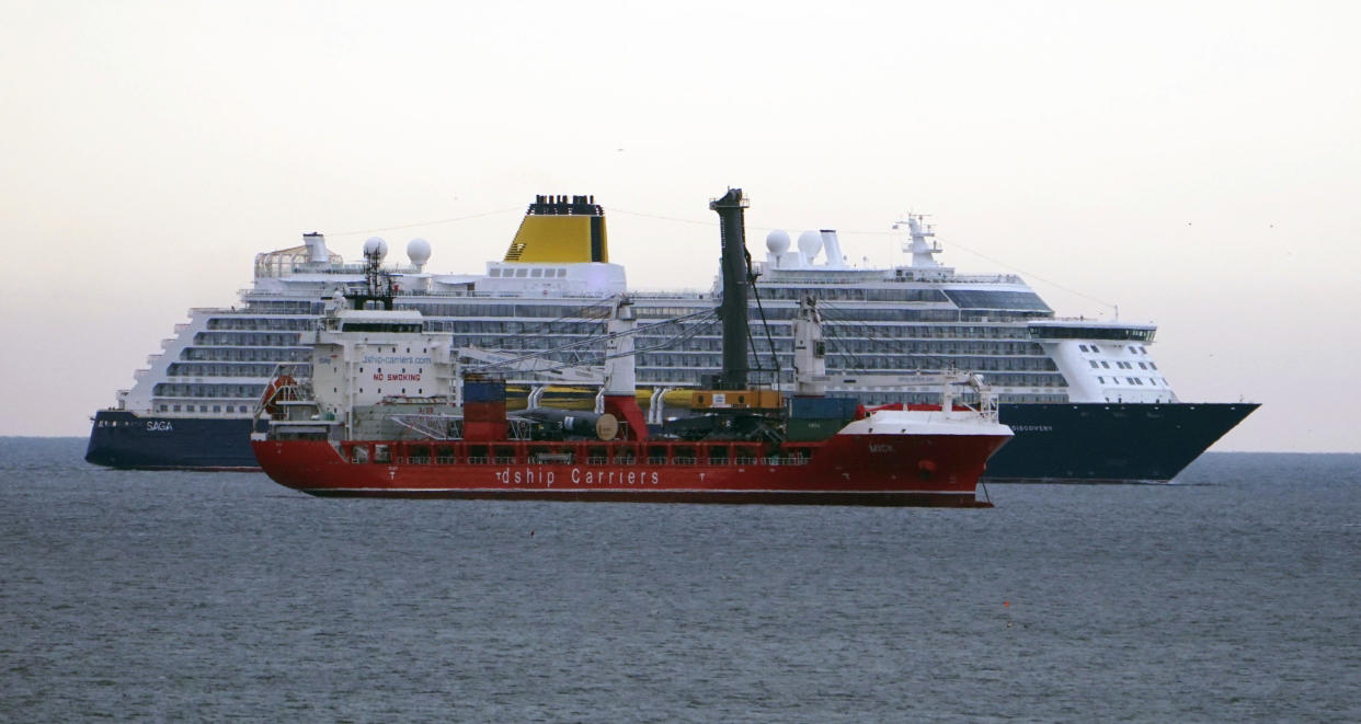 Saga's brand new 350 million pounds (dollars 440m US) cruise ship Spirit of Discovery passes a cargo vessel, as the liner heads into the River Tyne near Newcastle. north-east England, Friday July 12, 2019. The Spirit of Discovery will embark on its inaugural cruise in July. (Owen Humphreys/PA via AP)